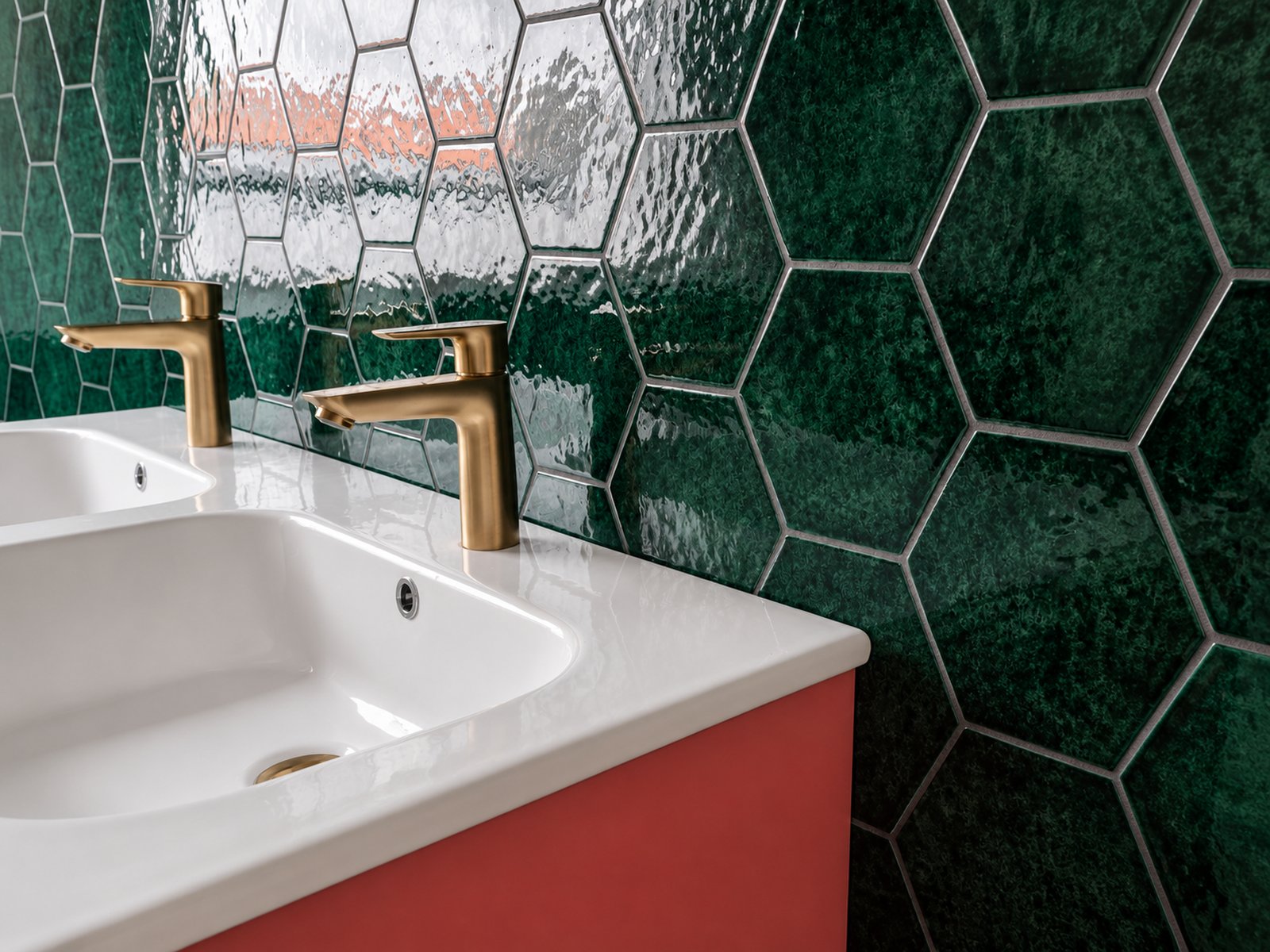 Double basin with brushed brass taps reflecting in deep green hexagonal tiles, renovated bathroom Bussum - Ruimte interior design